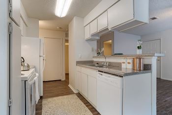 A kitchen with white appliances